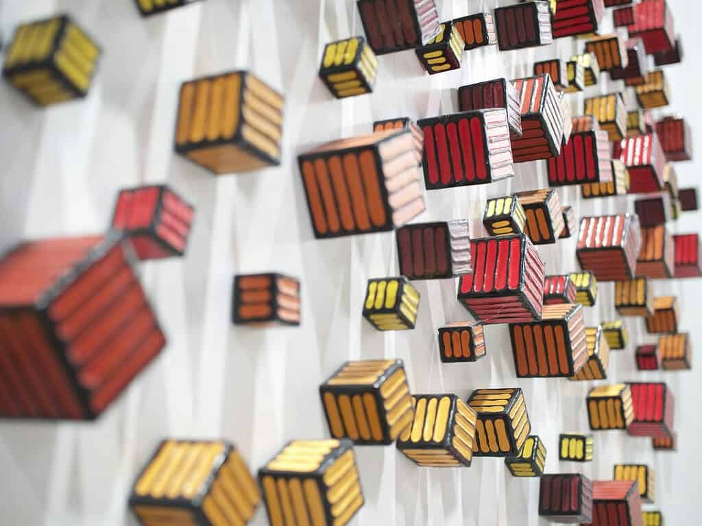 Abstract gold wall art red and yellow cubes